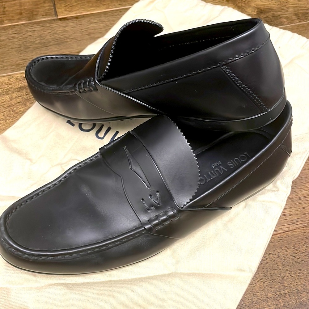 Black Louis Vuitton penny loafers size 7 1/2. Lightly worn, preteen condition.